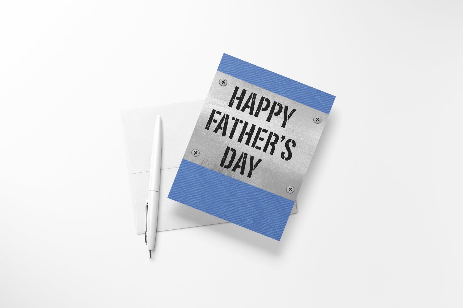 Blue denim Father's Day greeting card featuring a metal "Happy Father's Day" sign design, styled with a pen and white envelope.