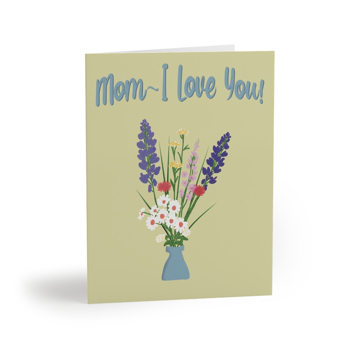 Light chartreuse greeting card, angled from the front left, displays a vase of colorful flowers and the text "Mom~ I Love You!”
