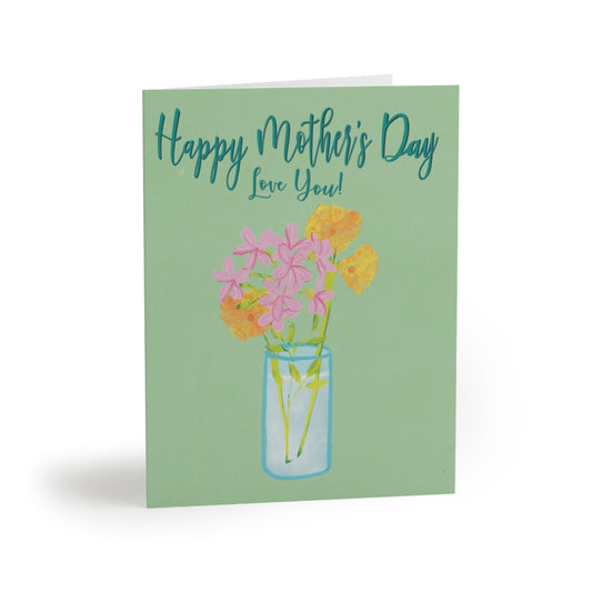 Light green card with teal text, “Happy Mother’s Day Love You!”. The card has a vase with pink and yellow flowers.
