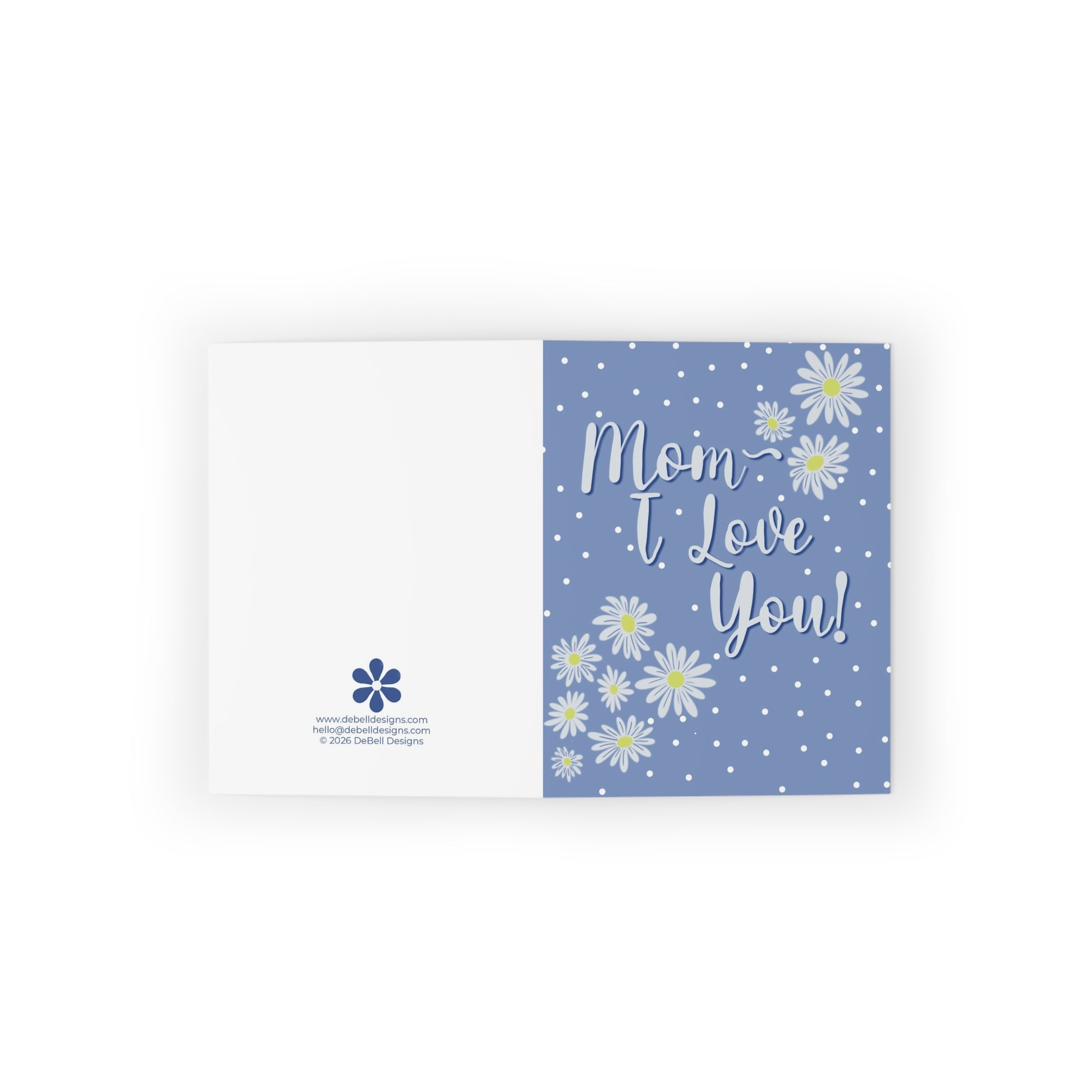 A blue and white greeting card. The front of the card has white text that says 'Mom I Love You!' in a script font. Surrounding the text are various sizes of white daisies with yellow centers and small white polka dots. The back of the card is white with a blue flower logo and website/email address.