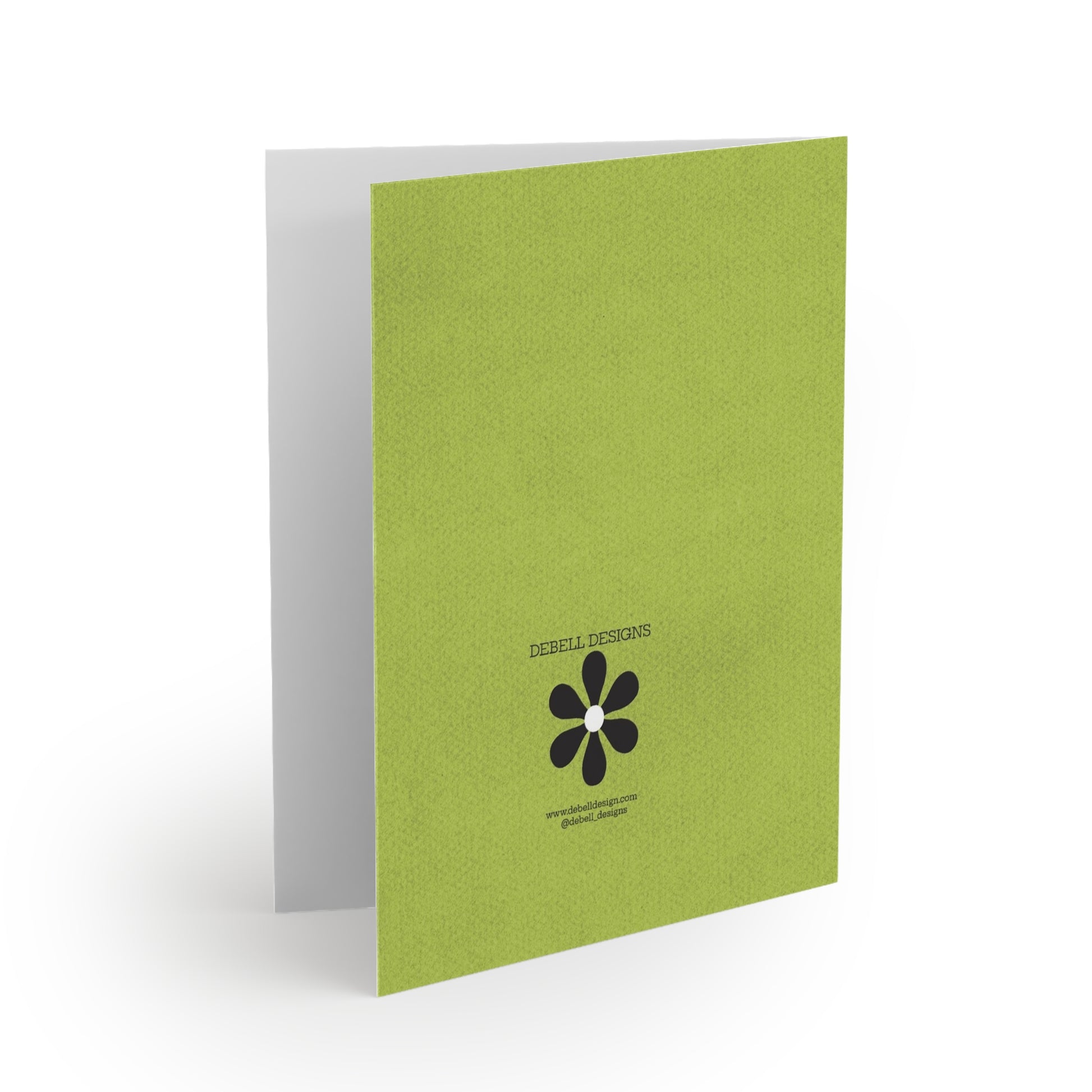 {"altText": "Open card on white background, angled right, showing the lime green back cover with "DEBELL DESIGNS" and a black flower logo, plus website and social media handle."}

