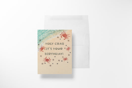 Holy crab it's your birthday' beach-themed card with crabs and starfish on sand
