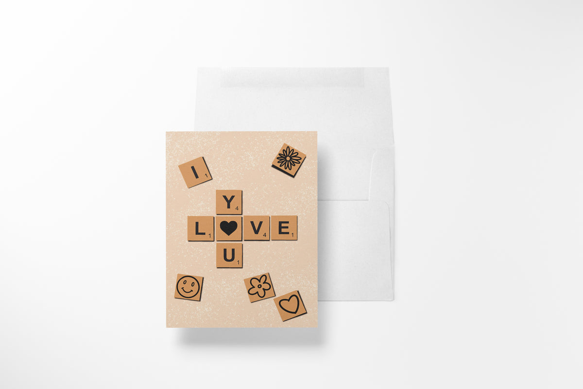 I love you" Scrabble tile greeting card, with heart, flower, and smiley face illustrations